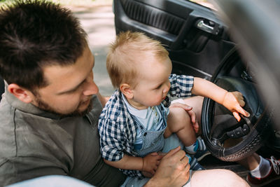 Boy playing with toy car