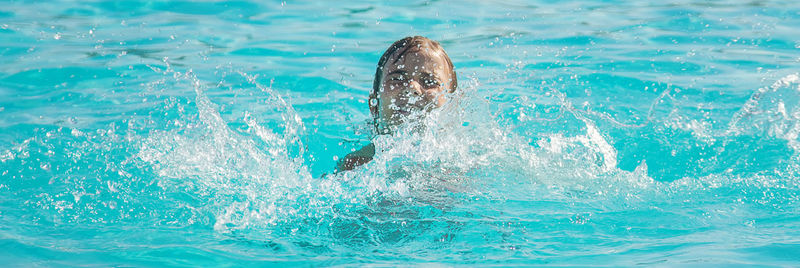 Close-up of swimming in sea
