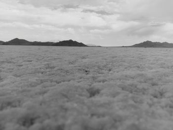 Scenic view of mountains against cloudy sky