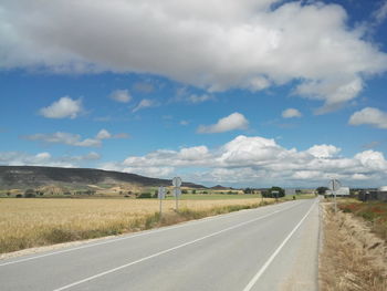 Road passing through field