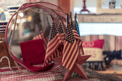 Close-up of small american flags on table