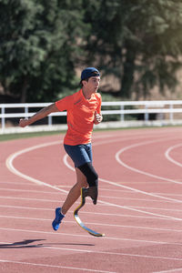 Full length of man running on road