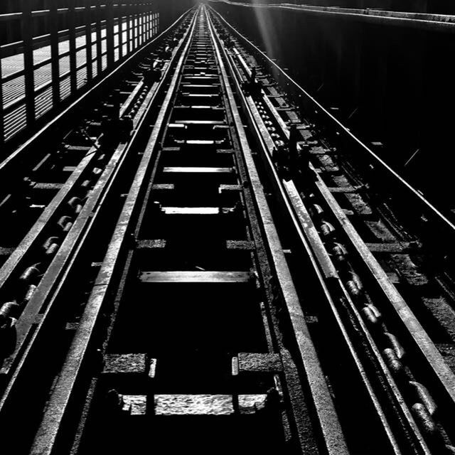 VIEW OF RAILROAD TRACKS AT NIGHT