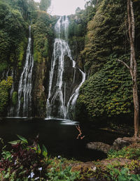 Woman diving into river