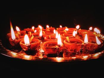 Close-up of lit candles on birthday cake