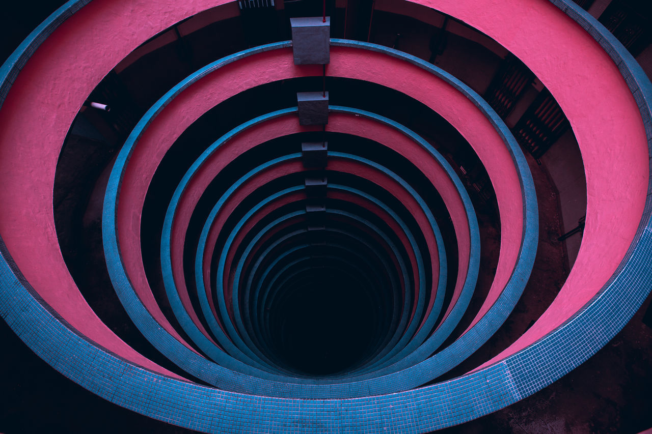 CLOSE-UP OF MULTI COLORED SPIRAL STAIRCASE