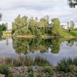 Reflection of trees in lake against sky
