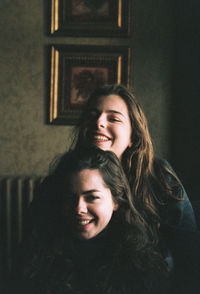 Portrait of smiling young woman at home