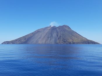 Scenic view of sea against blue sky