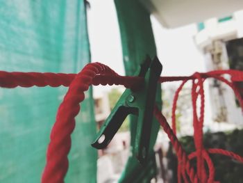 Close-up of bicycle hanging on rope