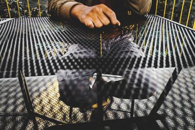 High angle view of man playing on floor