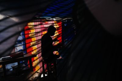 People standing in illuminated traditional clothing