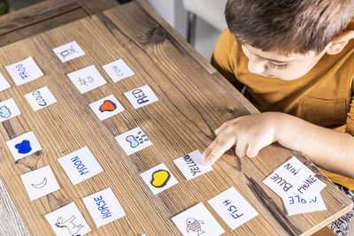 High angle view of man with text on table