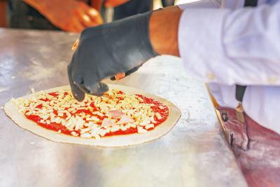 Midsection of person preparing food