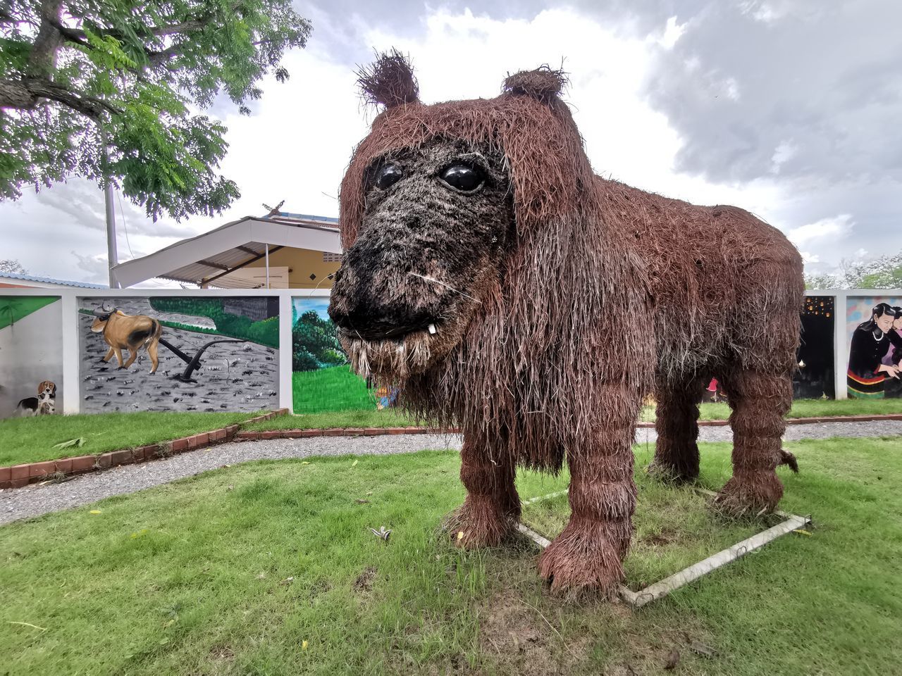 LION STANDING ON FIELD