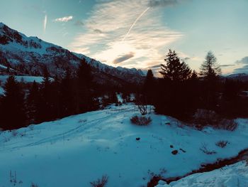 Scenic view of snow covered mountains against sky