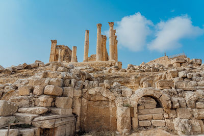 Low angle view of old ruin building against sky