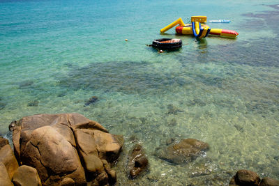 High angle view of rocks in sea