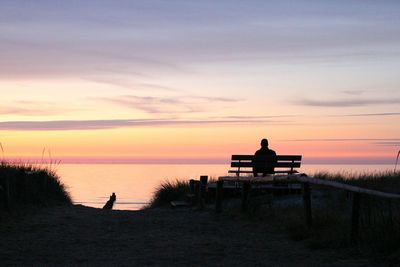 Rear view of silhouette people on beach