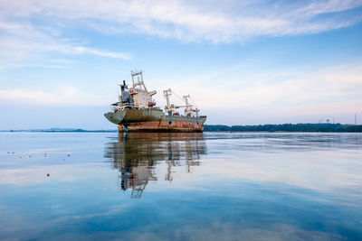 Ship on sea against sky