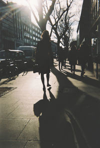 People walking on street in city