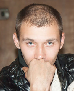 Close-up portrait of smiling man at home