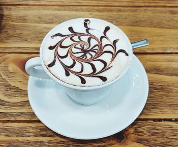 Close-up of coffee cup on table