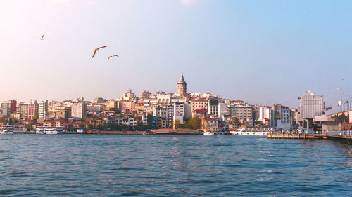 View of sea and buildings in city