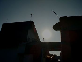 Low angle view of buildings against sky at sunset