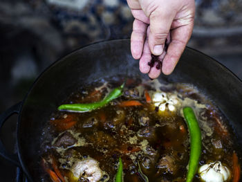 Uzbek pilaf. spices, raisins, barberries, chilli,  garlic heads are added to lamb stew with carrots.