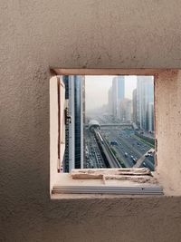 High angle view of buildings seen through window