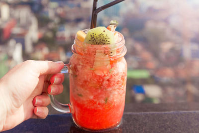 Close-up of hand holding drink