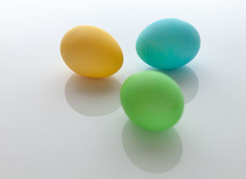 Close-up of multi colored candies against white background