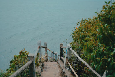 High angle view of steps leading towards sea