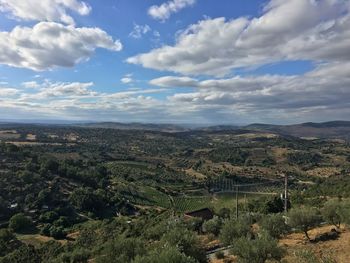 Aerial view of landscape against clouded sky