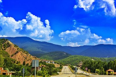 Scenic view of mountains against cloudy sky