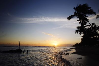 Scenic view of sea against sky at sunset