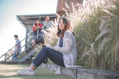 Young couple sitting outdoors
