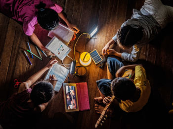 High angle view of people on table