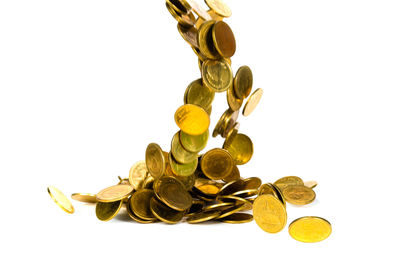 Close-up of coins on white background