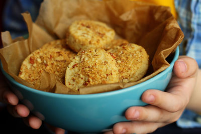 Cropped hand holding food