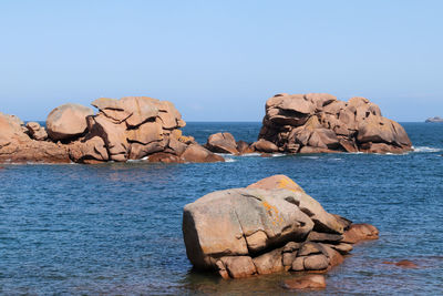 Bizarre boulders on the cote de granit rose - pink granite coast - in brittany, france