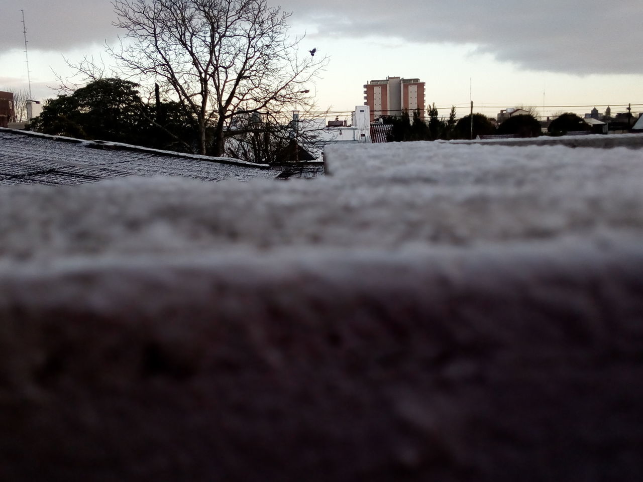 SURFACE LEVEL OF ROAD BY BUILDINGS AGAINST SKY