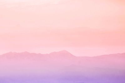 Scenic view of mountains against sky during sunset