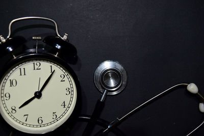 Close-up of clock on table
