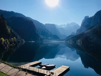 Scenic view of lake and mountains against sky