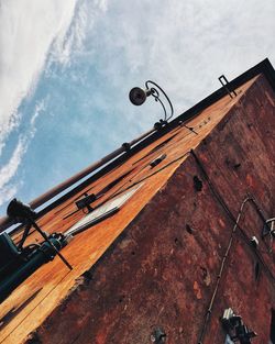 Low angle view of street light against sky