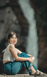 Portrait of woman sitting outdoors