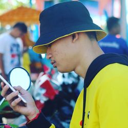 Teenage boy using mobile phone outdoors