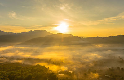Scenic view of mountains against sky during sunset